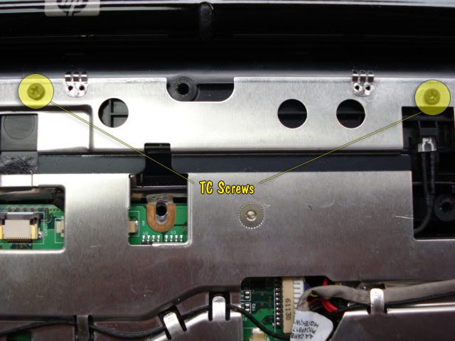 b) Now heres the tricky part. You will need to pull back the medal which is covering the logic to be able to see and remove the input.