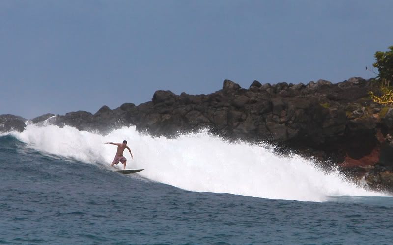 IMAGE: http://i272.photobucket.com/albums/jj183/justinhang/waimea-surfer.jpg